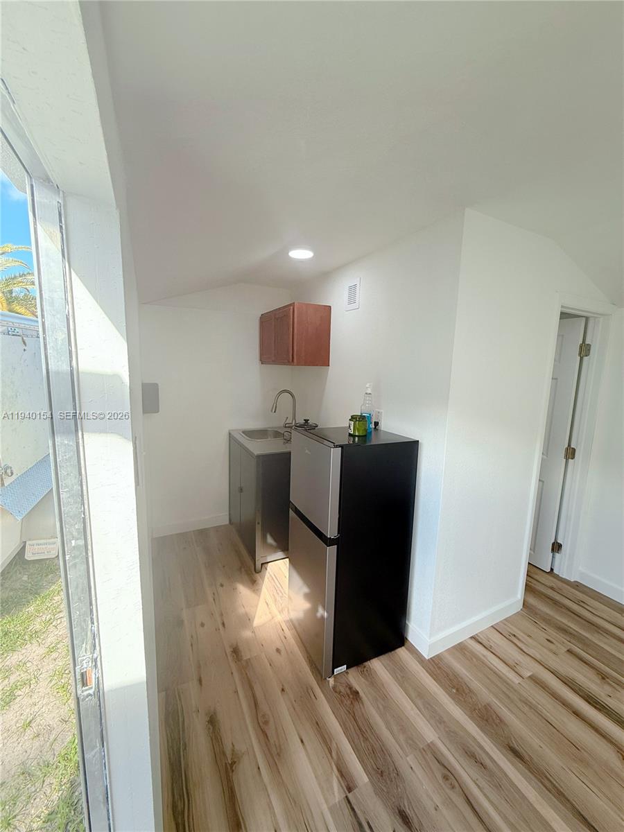 14214 Southwest 289th Terrace, Unit 2 Homestead, FL 33033 - Photo 6 of 6 a bedroom with a bed and a mirror