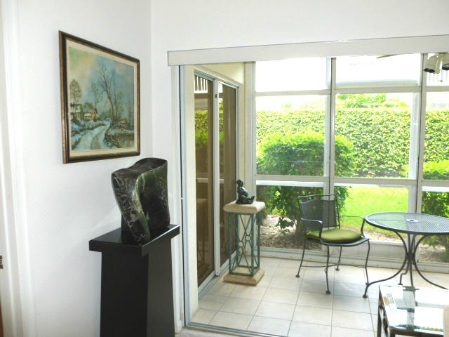 340 Northwest 67th Street, Unit 101 Boca Raton, FL 33487 - Photo 6 of 26 Patio as seen from Living area