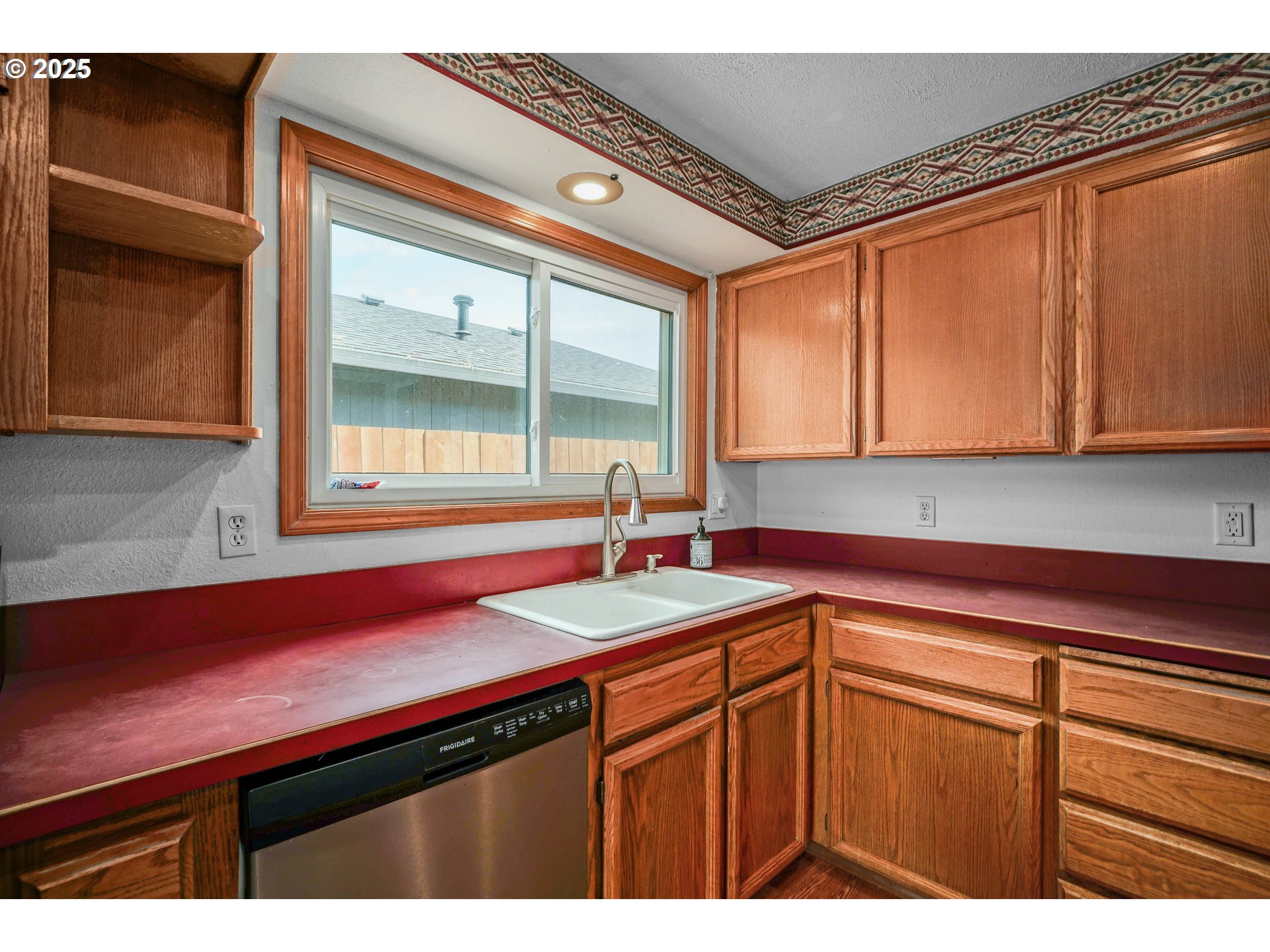 5259 Spring Leaf Court North Keizer, OR 97303 - Photo 13 of 30 a kitchen with a sink cabinets and window