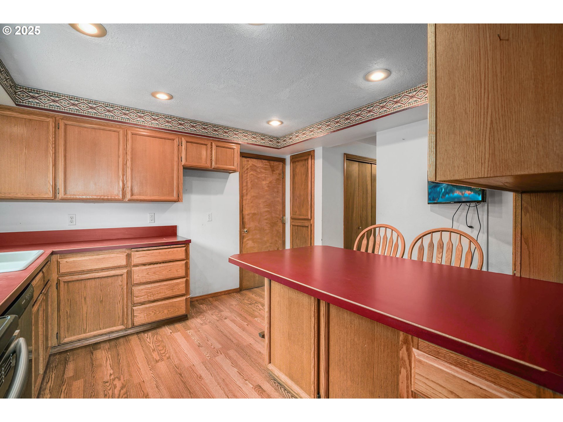 5259 Spring Leaf Court North Keizer, OR 97303 - Photo 14 of 30 a kitchen with granite countertop a stove a sink and dishwasher