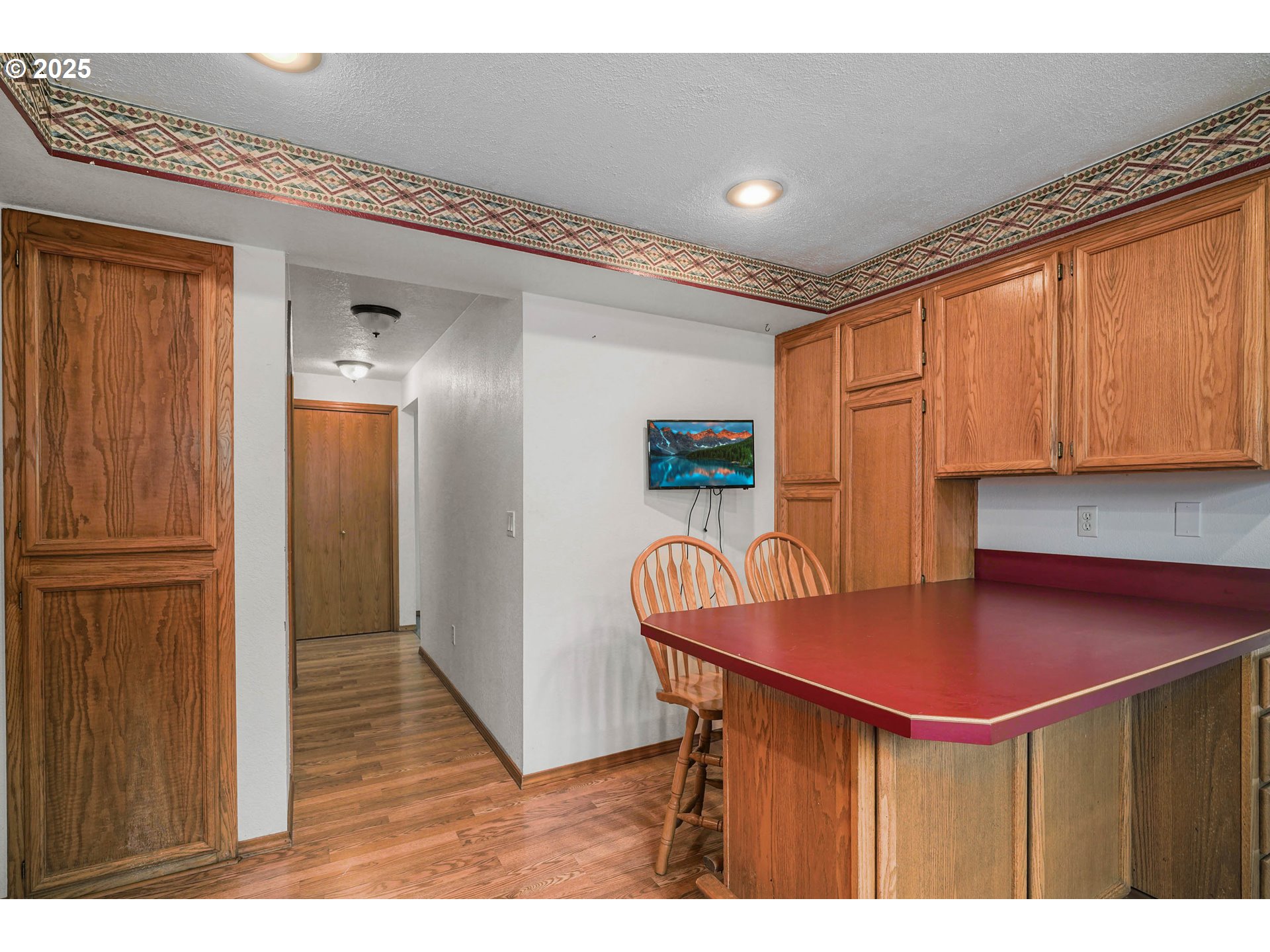5259 Spring Leaf Court North Keizer, OR 97303 - Photo 15 of 30 a kitchen with stainless steel appliances kitchen island granite countertop a sink cabinets and wooden floor