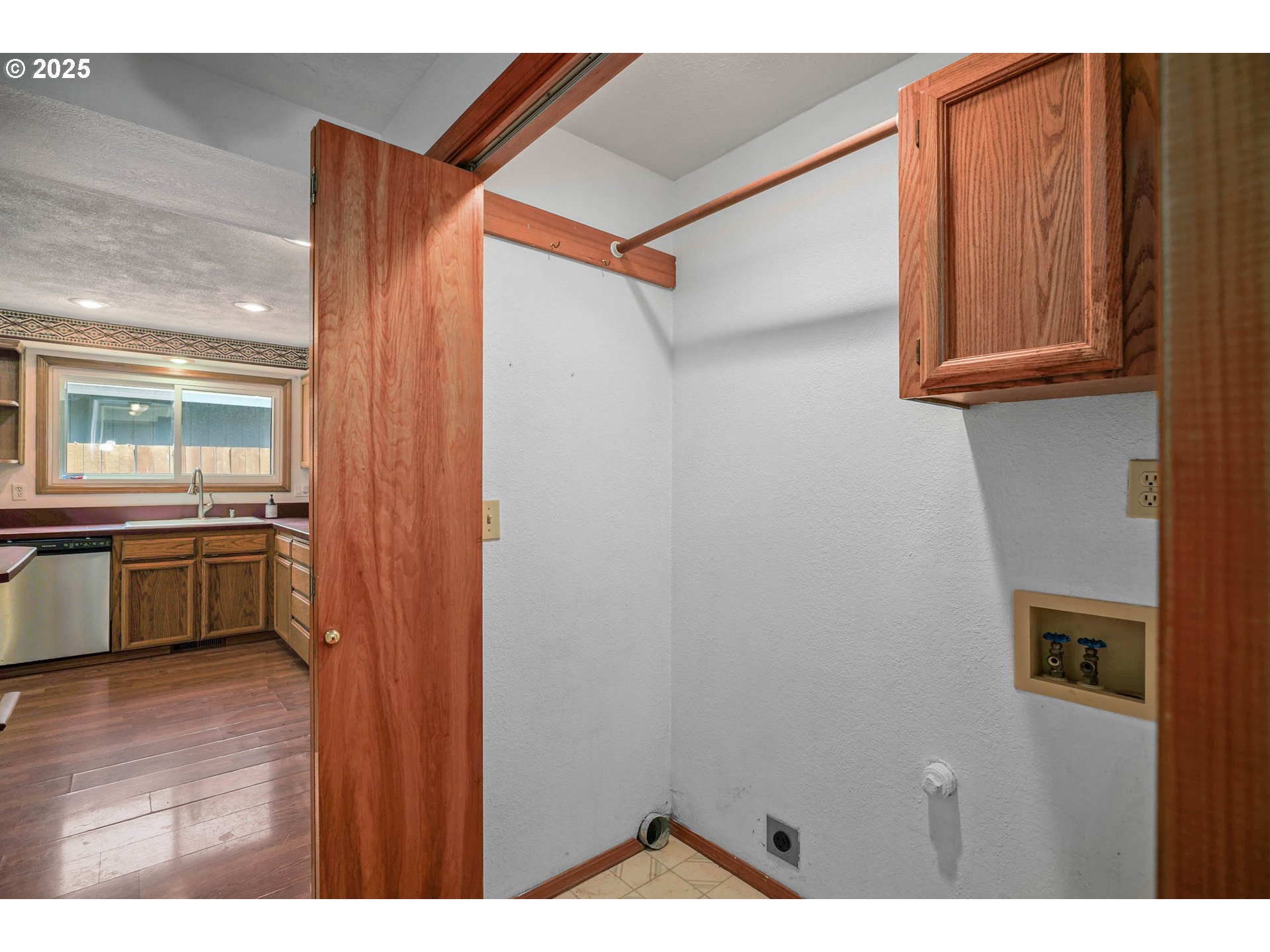 5259 Spring Leaf Court North Keizer, OR 97303 - Photo 17 of 30 a view of a hallway with wooden floor and a kitchen