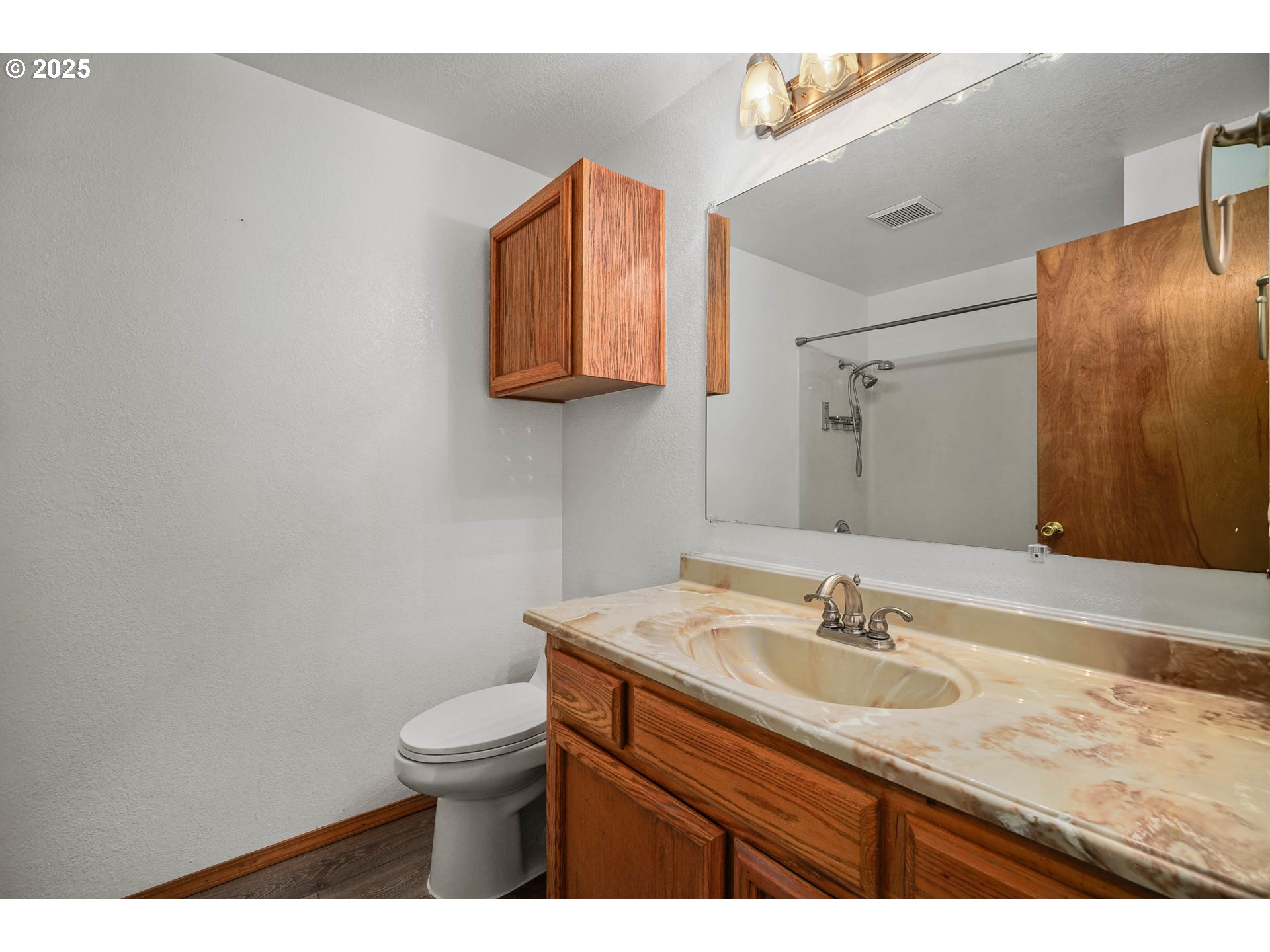 5259 Spring Leaf Court North Keizer, OR 97303 - Photo 25 of 30 a bathroom with a granite countertop sink toilet and a mirror