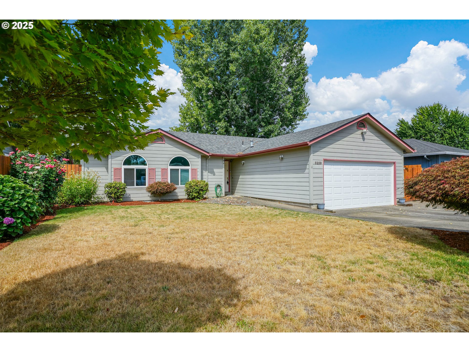 5259 Spring Leaf Court North Keizer, OR 97303 - Photo 3 of 30 a view of house with backyard and garden