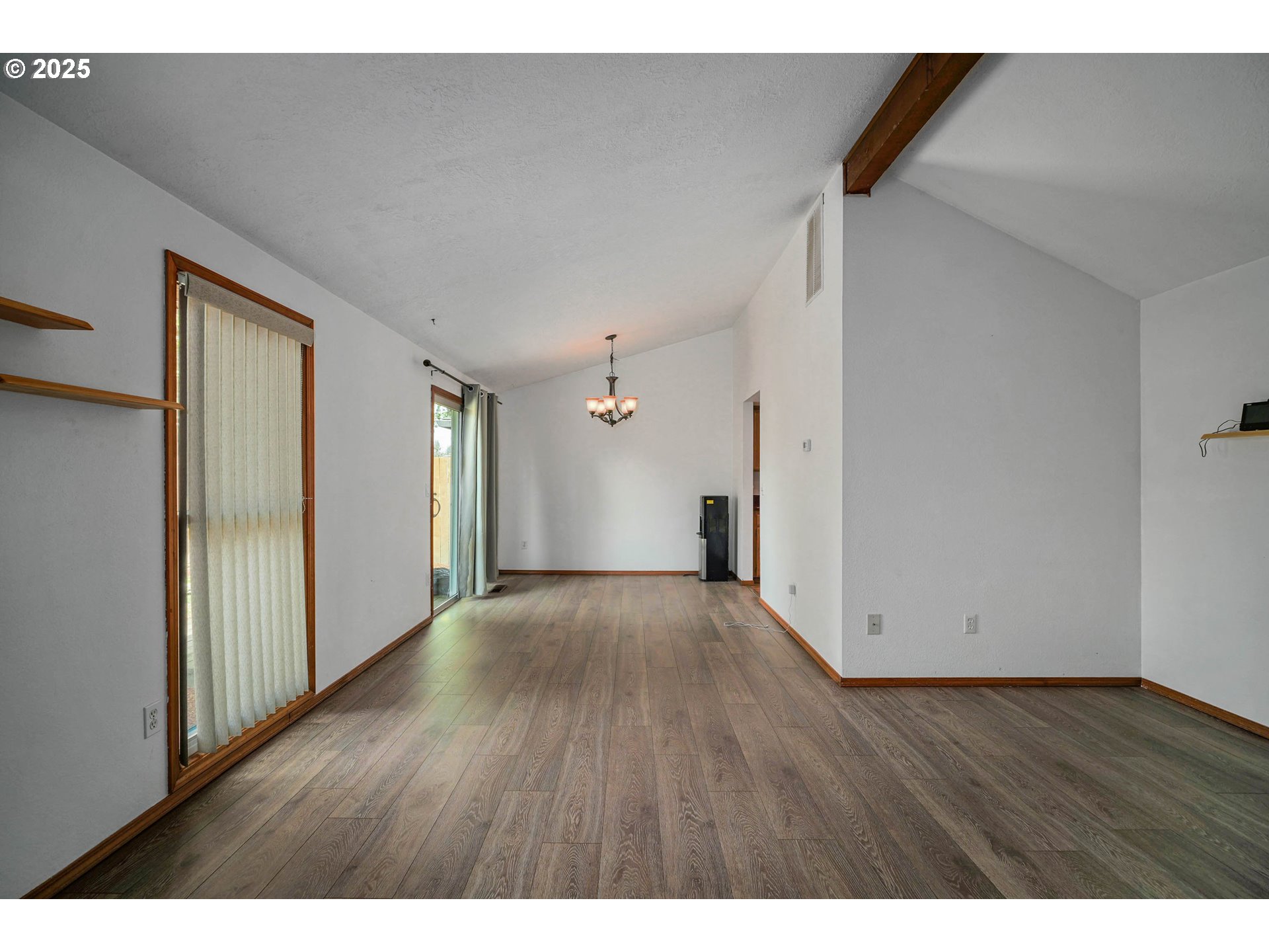 5259 Spring Leaf Court North Keizer, OR 97303 - Photo 10 of 30 a view of an empty room with wooden floor