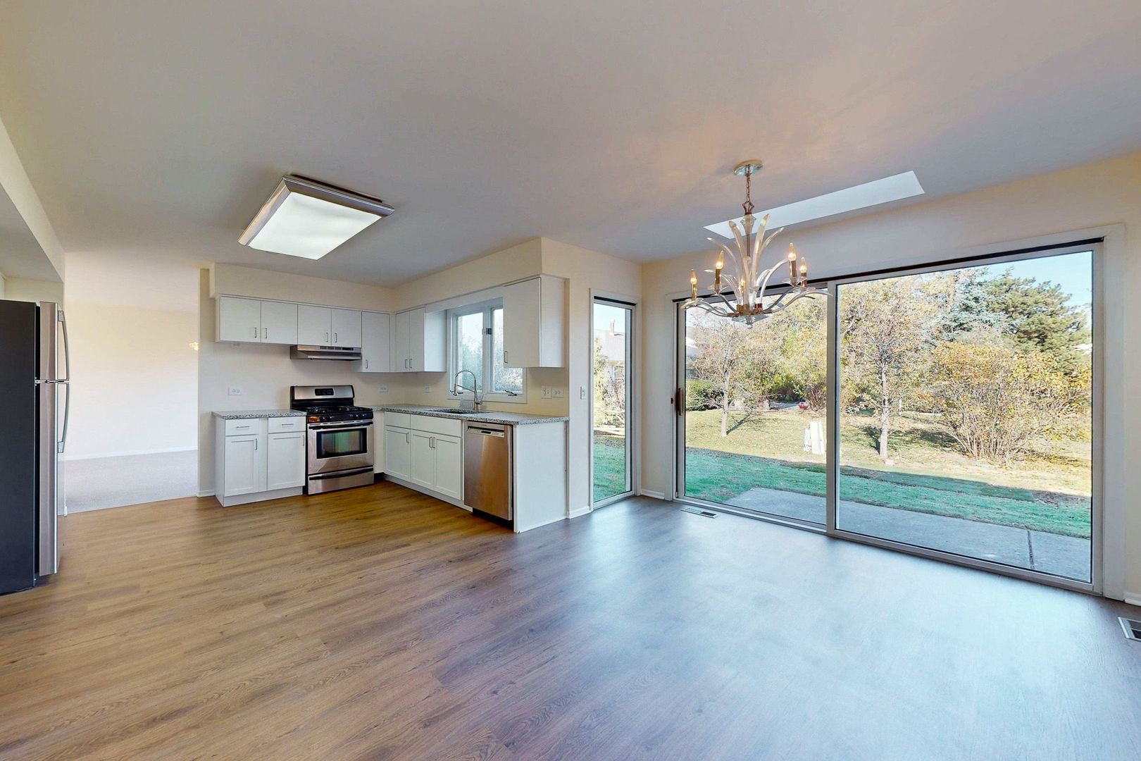 3820 Kiess Drive Glenview, IL 60026 - Photo 12 of 44 a view of a kitchen with wooden floor and a kitchen