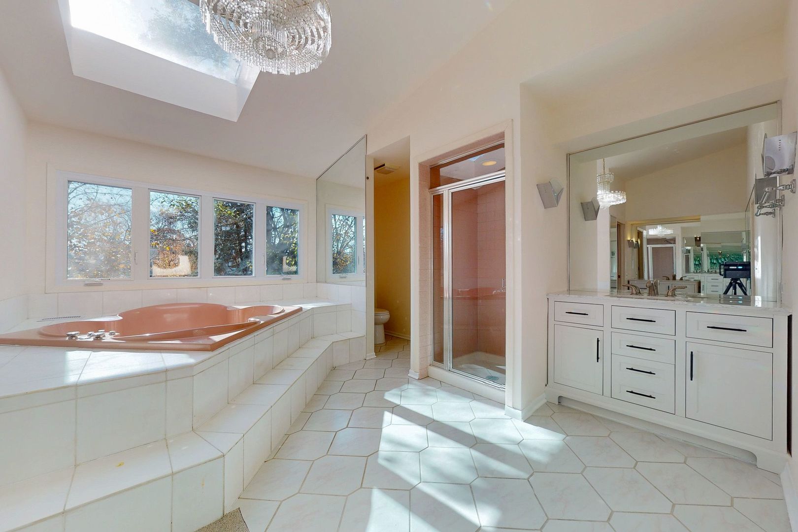 3820 Kiess Drive Glenview, IL 60026 - Photo 24 of 44 a spacious bathroom with a granite countertop sink a mirror and a bathtub