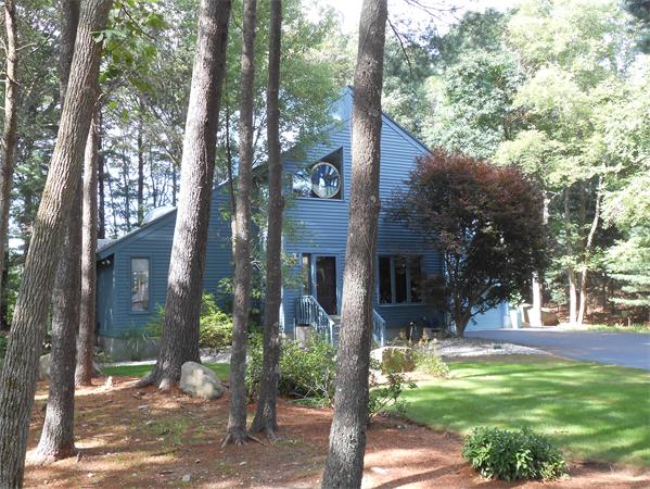 203 Hampton Road Sharon, MA 02067 - Photo 3 of 29 a front view of a house with a tree in front