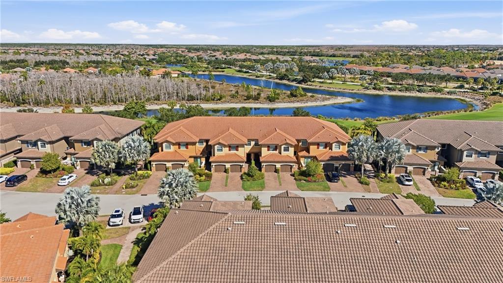 8773 Bellano Court, Unit 103 Naples, FL 34119 - Photo 3 of 47 Aerial view of residential area featuring a large body of water
