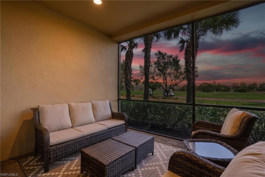 8773 Bellano Court, Unit 103 Naples, FL 34119 - Photo 33 of 47 Sunroom / solarium featuring a textured wall