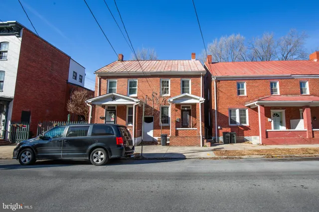 a car parked in front of a house
