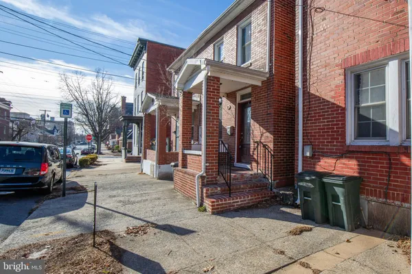 a view of street with parked cars