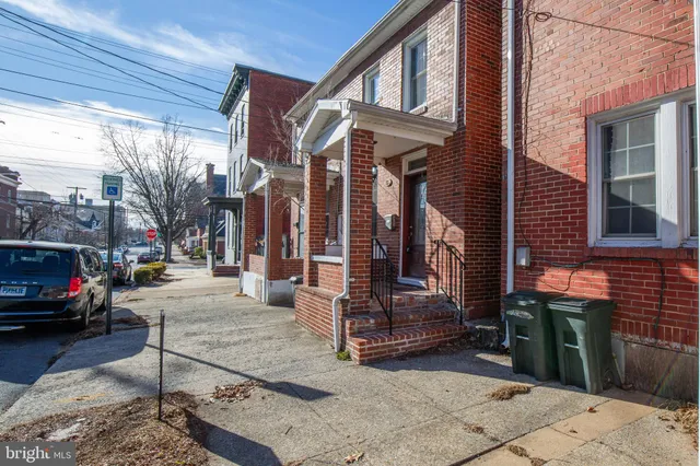 a view of street with parked cars