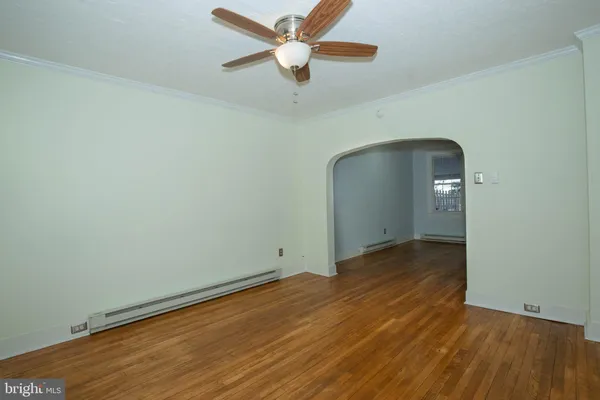 a view of a hallway view with wooden floor and staircase
