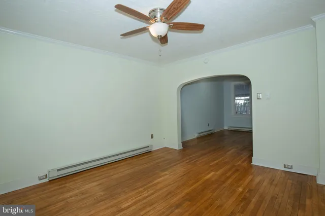a view of a hallway view with wooden floor and staircase