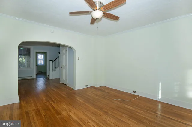 a view of livingroom with hardwood and stairs