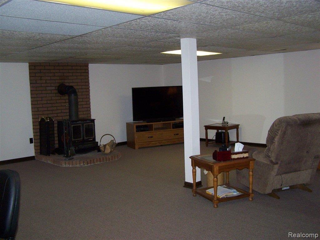 1294 Peavy Road Howell, MI 48843 - Photo 16 of 28 WOOD BURNER IN FAMILY ROOM