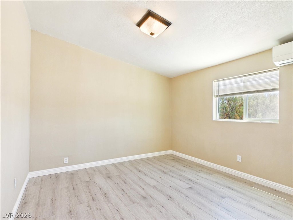4081 Retread Road Pahrump, NV 89048 - Photo 41 of 98 A quiet, naturally illuminated bedroom awaits with durable light wood-look flooring.