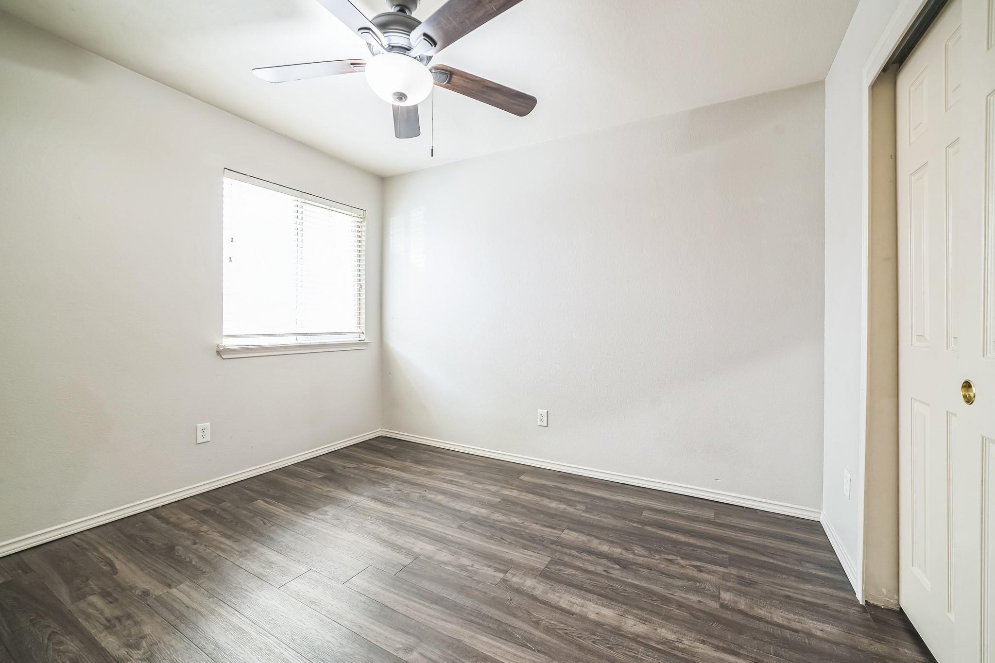 3630 Spring Canyon Trail Round Rock, TX 78681 - Photo 14 of 23 Unfurnished bedroom with a closet, dark wood-style flooring, and ceiling fan