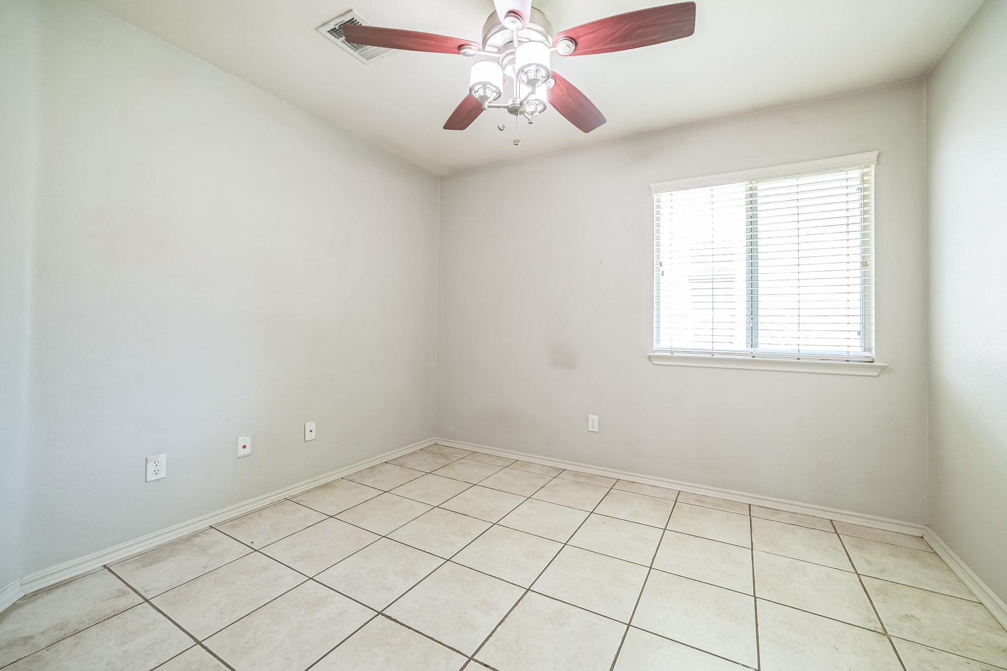 3630 Spring Canyon Trail Round Rock, TX 78681 - Photo 16 of 23 Spare room featuring ceiling fan and light tile patterned floors
