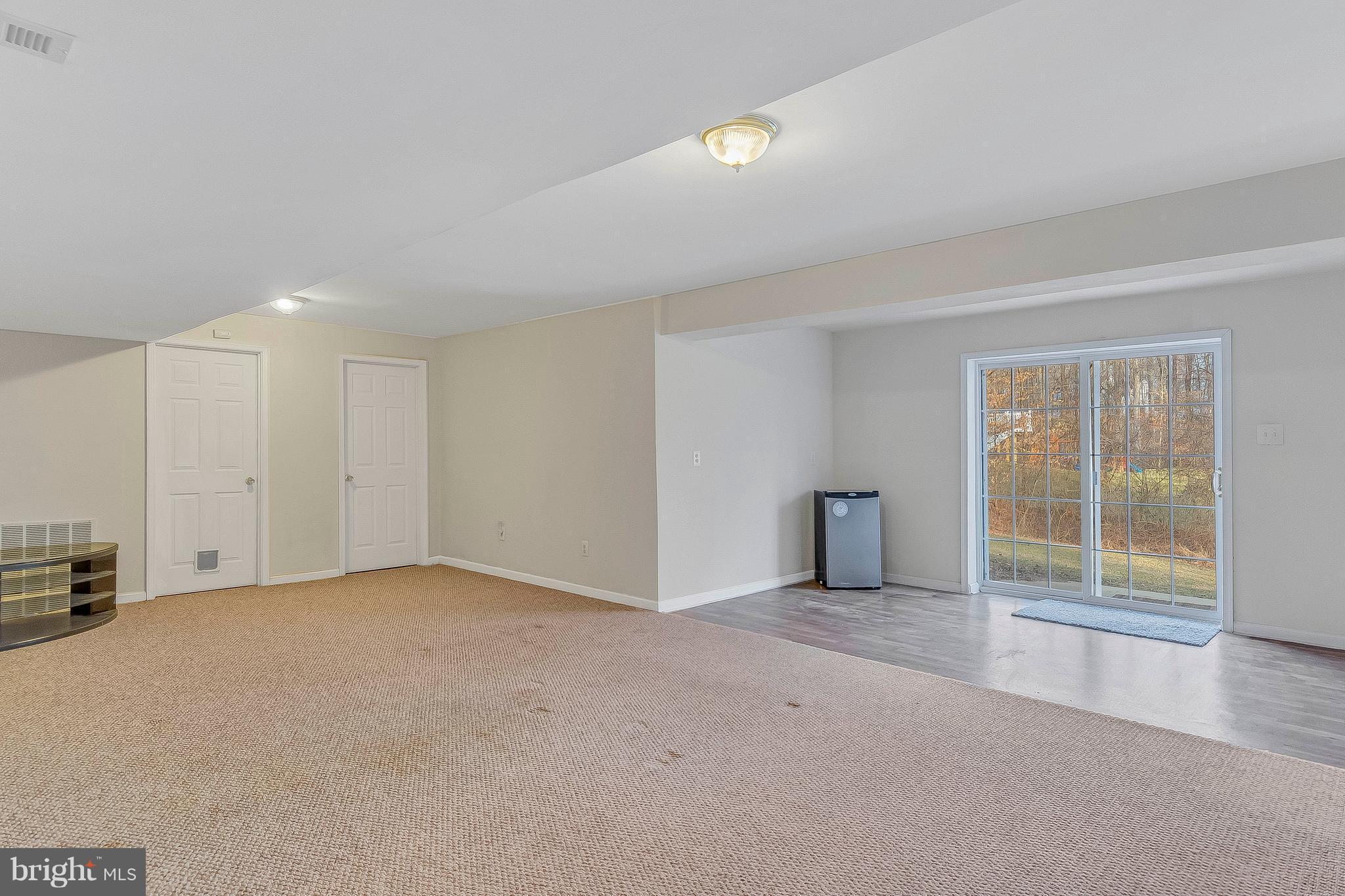 4613 Green Ridge Court Huntingtown, MD 20639 - Photo 23 of 29 Lower level rec room w/walkout slider to back yard