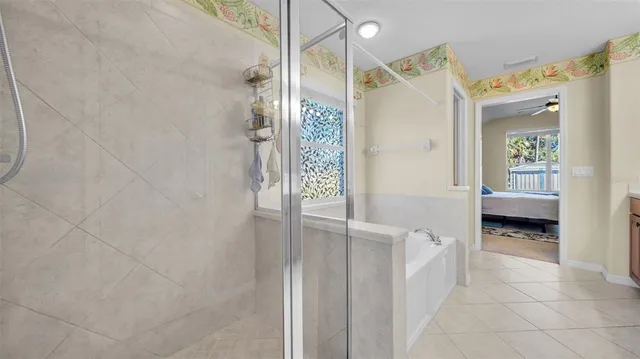 a view of a bathroom with tub and window