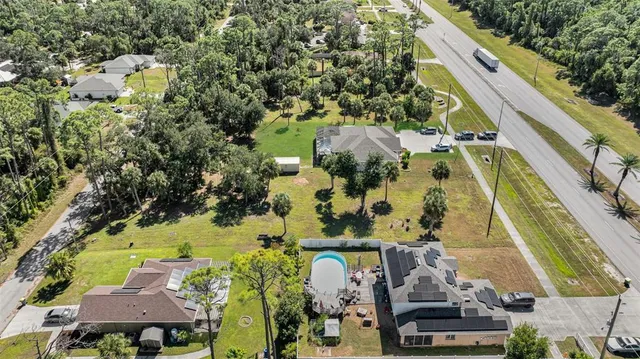an aerial view of residential houses with outdoor space