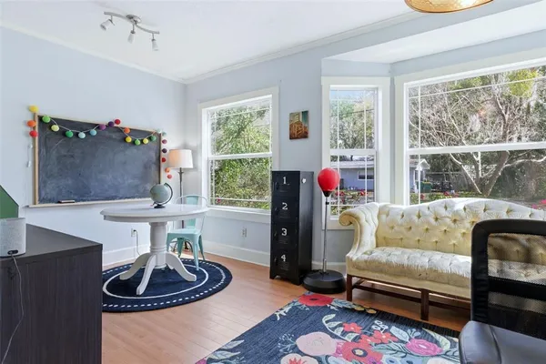 a bedroom with furniture and a window