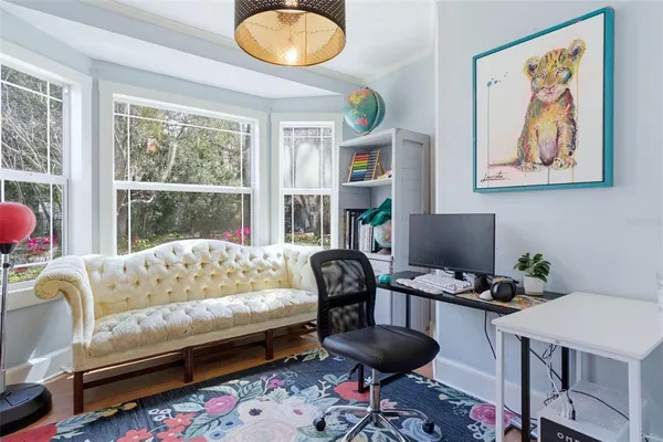 a living room with furniture and a rug
