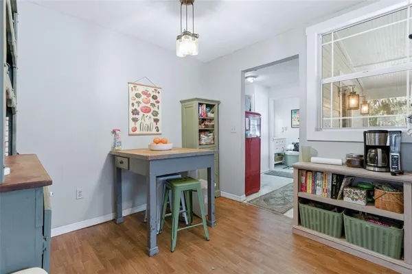 a utility room with dryer washer and a view of living room