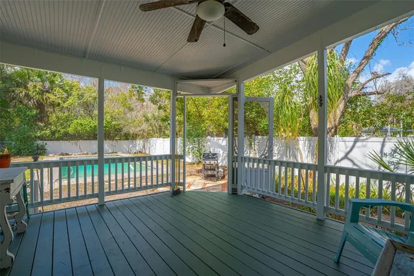 a view of a yard with swimming pool