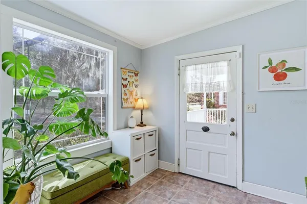 a spacious bedroom with a bed and a window