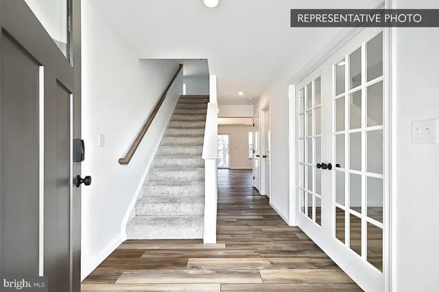 a view of staircase with white walls