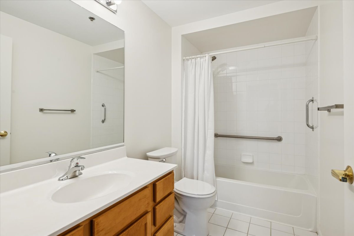 440 West Mahogany Court, Unit 203 Palatine, IL 60067 - Photo 11 of 17 a bathroom with a sink toilet and shower