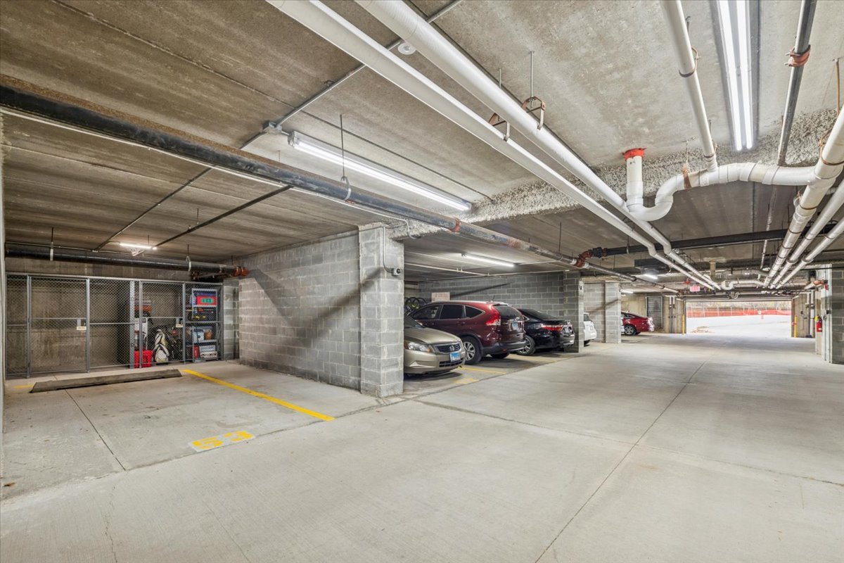 440 West Mahogany Court, Unit 203 Palatine, IL 60067 - Photo 15 of 17 a view of parking garage with cars