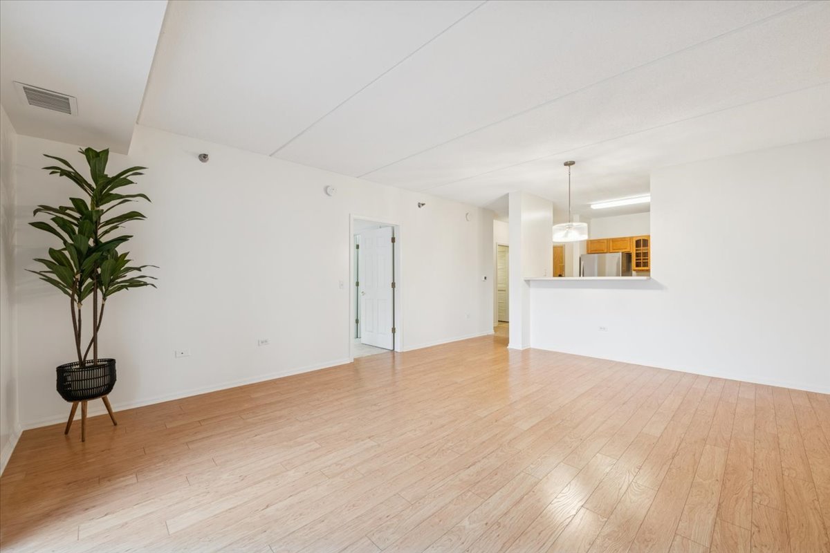 440 West Mahogany Court, Unit 203 Palatine, IL 60067 - Photo 3 of 17 a view of an empty room and glass door
