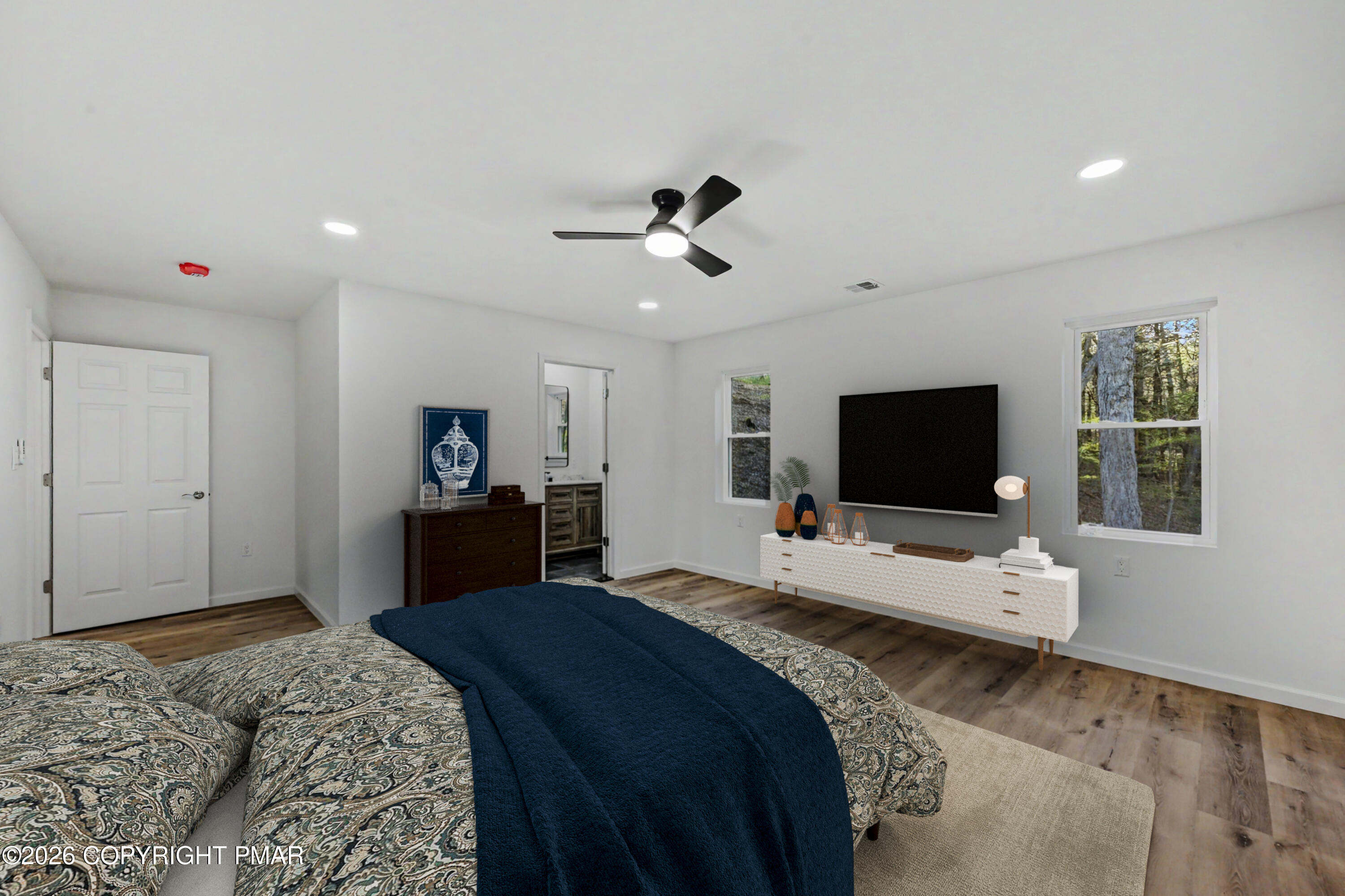1131 Mink Court Bushkill, PA 18324 - Photo 38 of 81 a bedroom with a bed and a flat screen tv