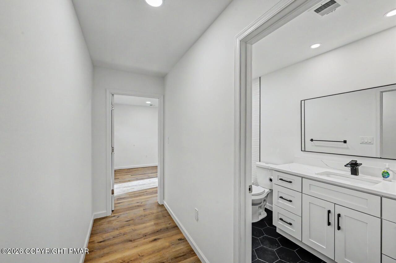 1131 Mink Court Bushkill, PA 18324 - Photo 51 of 81 a bathroom with a sink and a mirror