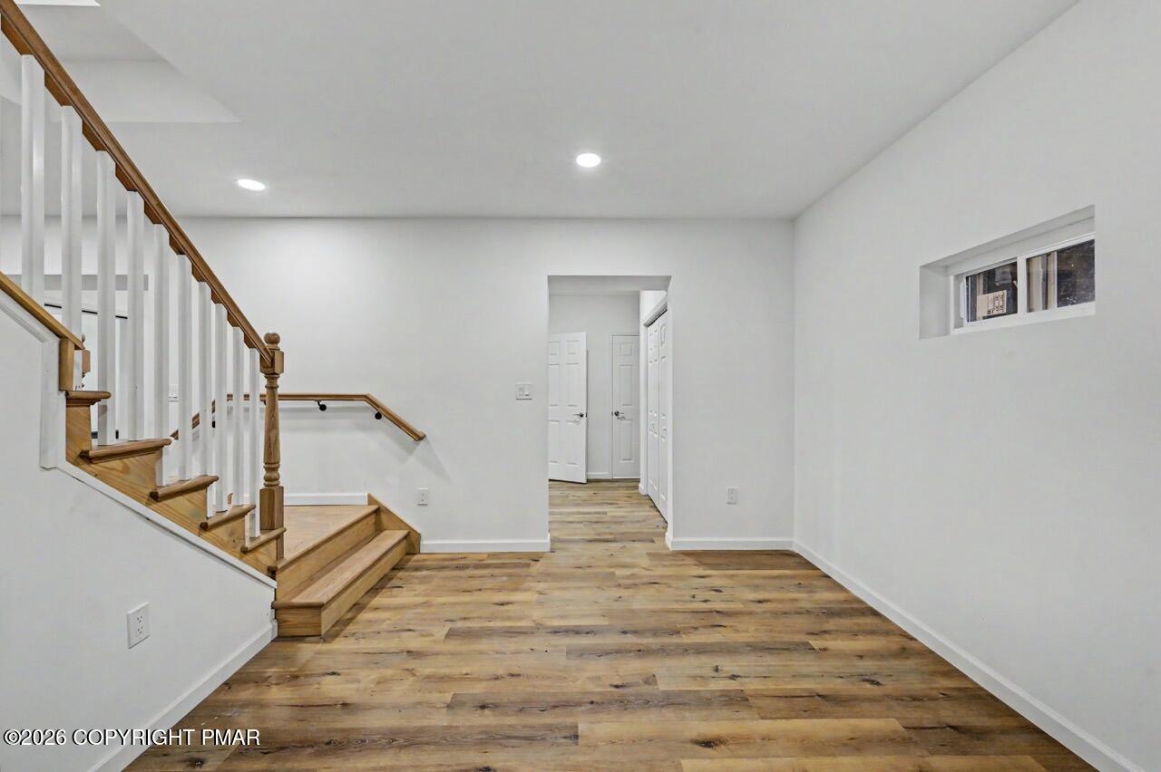 1131 Mink Court Bushkill, PA 18324 - Photo 62 of 81 a view of entryway and hall with wooden floor