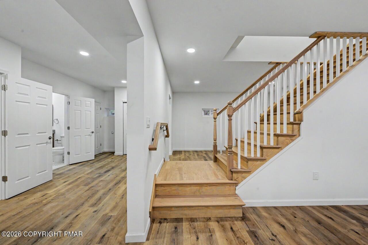 1131 Mink Court Bushkill, PA 18324 - Photo 68 of 81 a view of entryway and hall with wooden floor