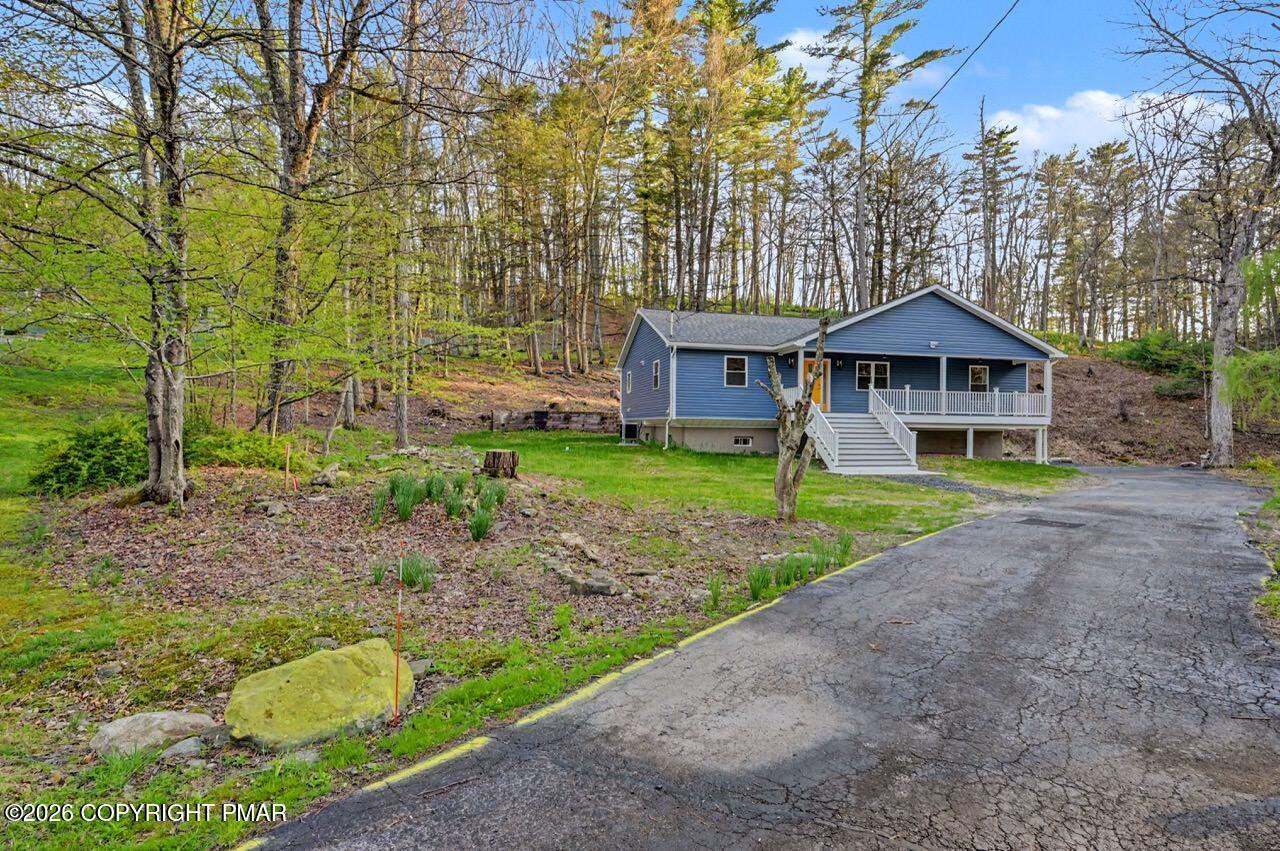 1131 Mink Court Bushkill, PA 18324 - Photo 7 of 81 a front view of a house with garden