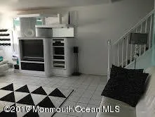 a black and white kitchen with a sink