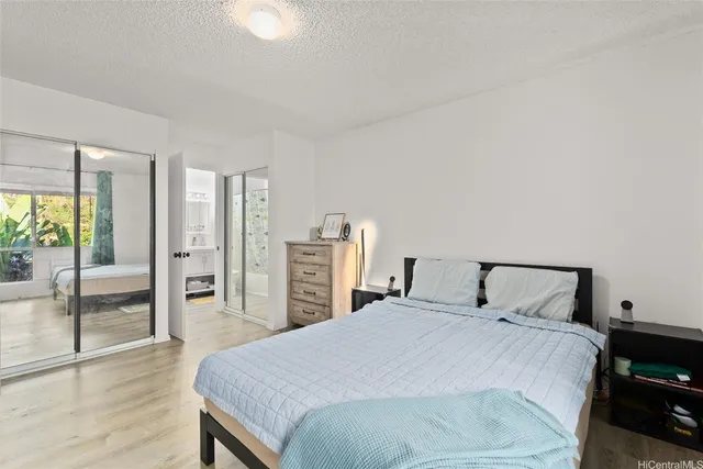 a bedroom with a large bed and a view of bedroom