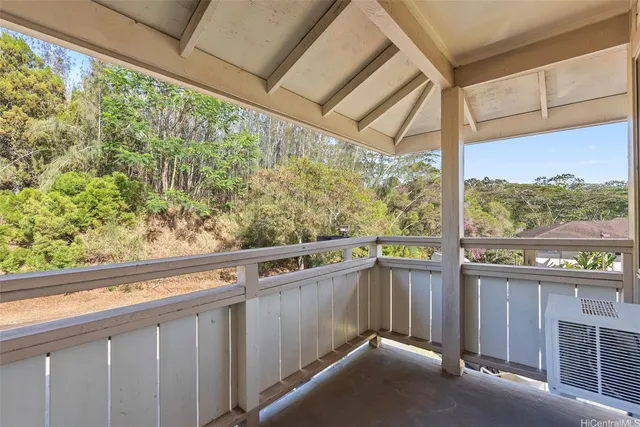 a view of a balcony with plants