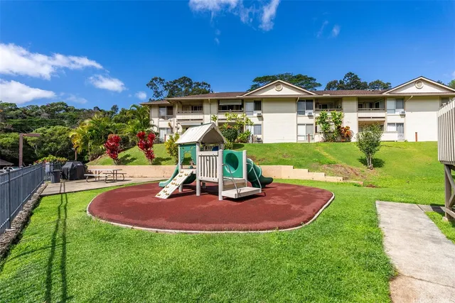 a view of a house with pool yard and sitting area
