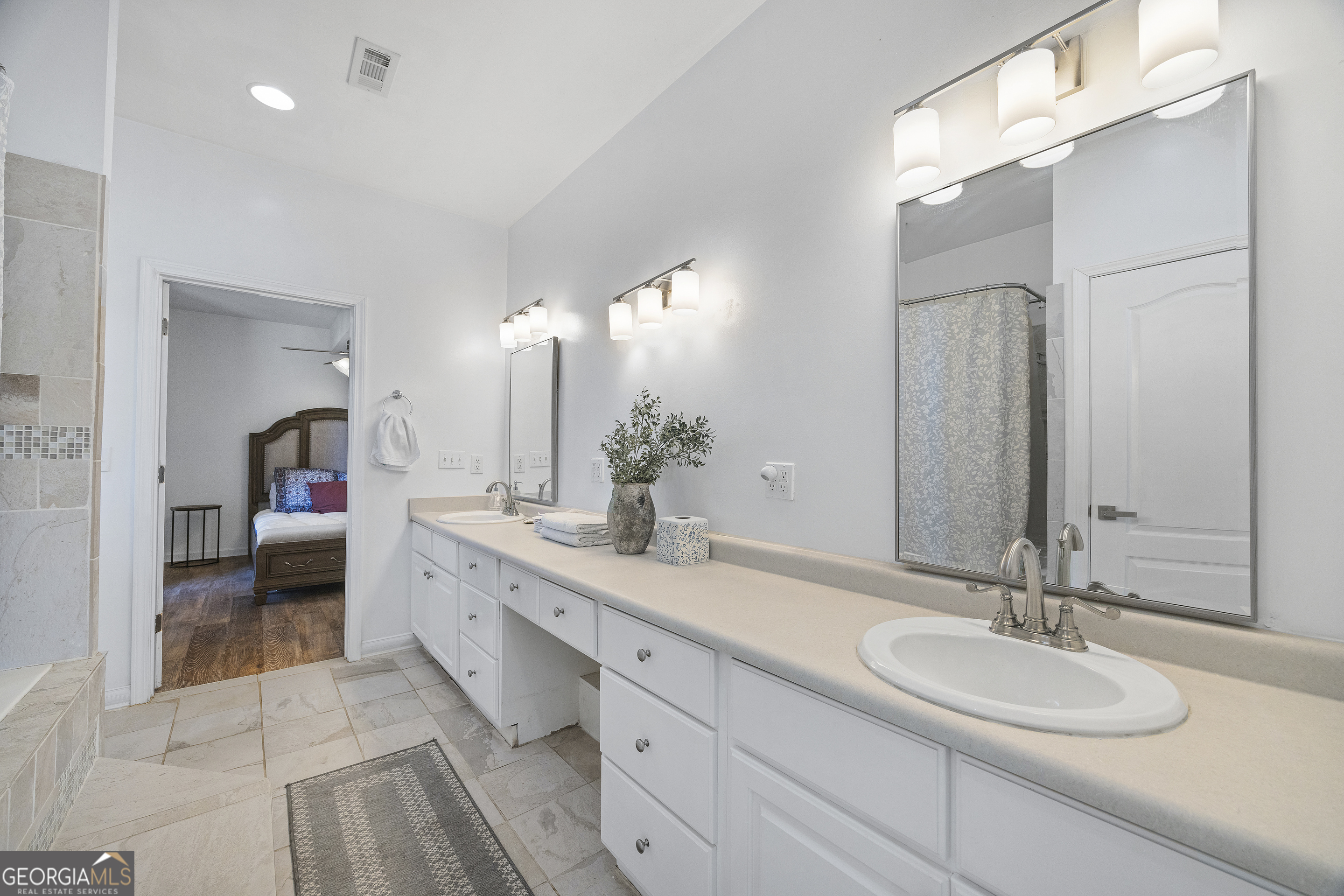 2565 New Franklin Church Road Canon, GA 30520 - Photo 102 of 168 a spacious bathroom with a double vanity sink a mirror and a shower