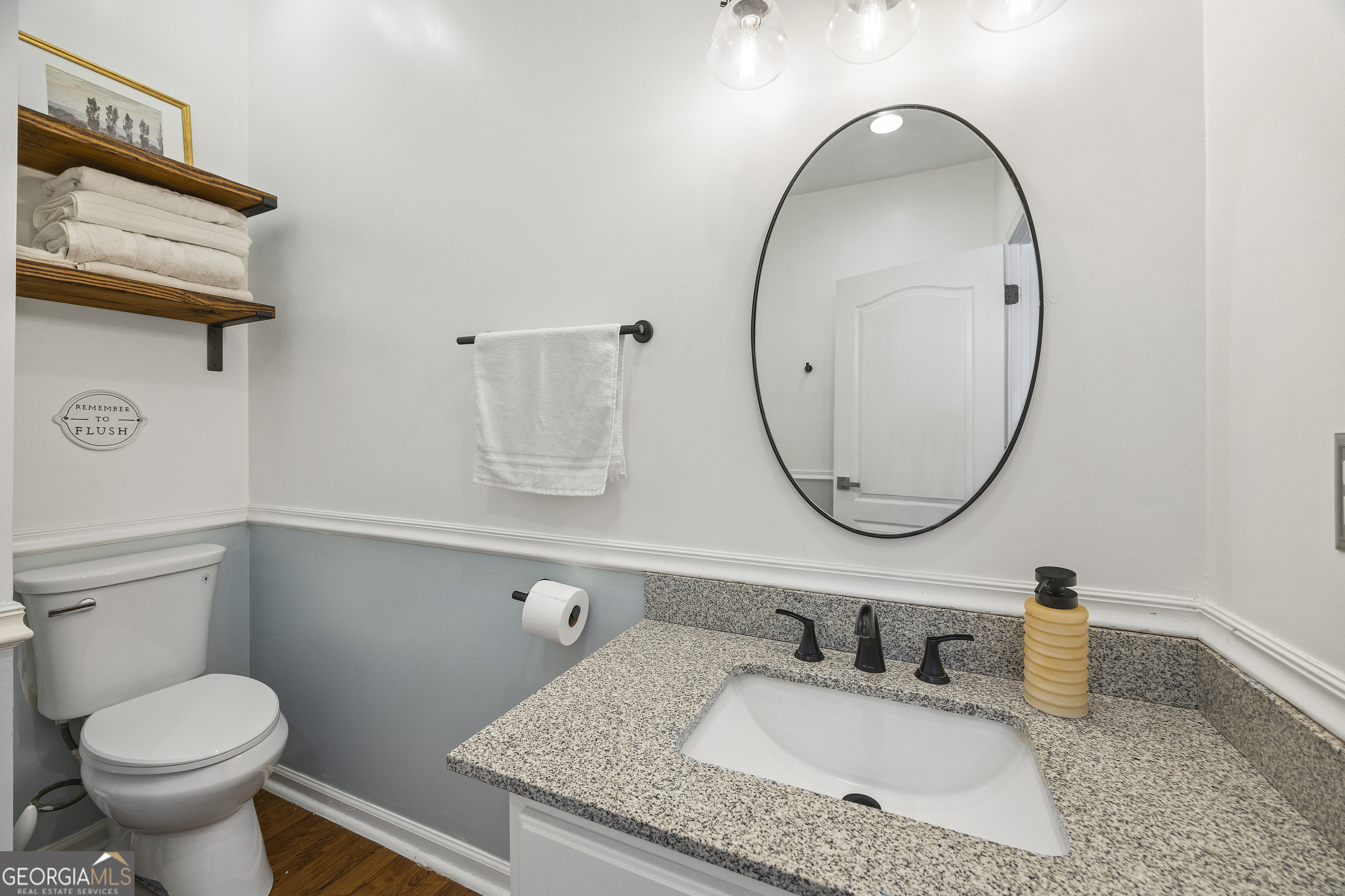 2565 New Franklin Church Road Canon, GA 30520 - Photo 111 of 168 a bathroom with a granite countertop toilet sink and mirror