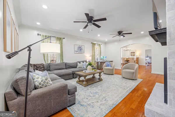 a bathroom with a toilet a sink and a mirror