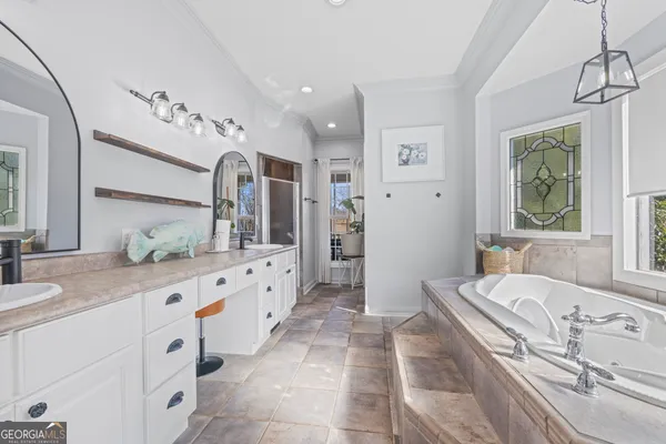 a kitchen with stainless steel appliances granite countertop a stove and cabinets