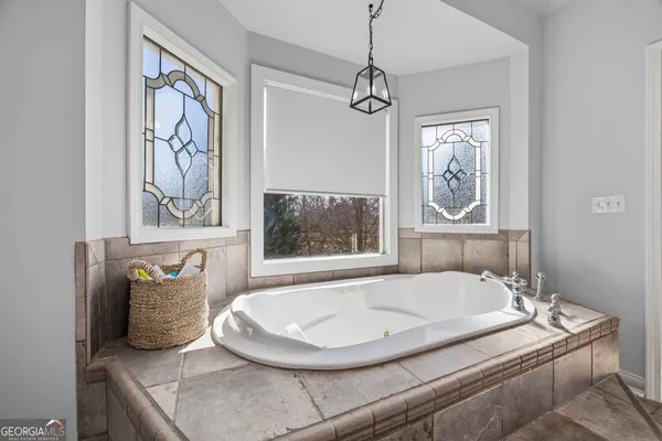 a kitchen with stainless steel appliances granite countertop a stove and cabinets